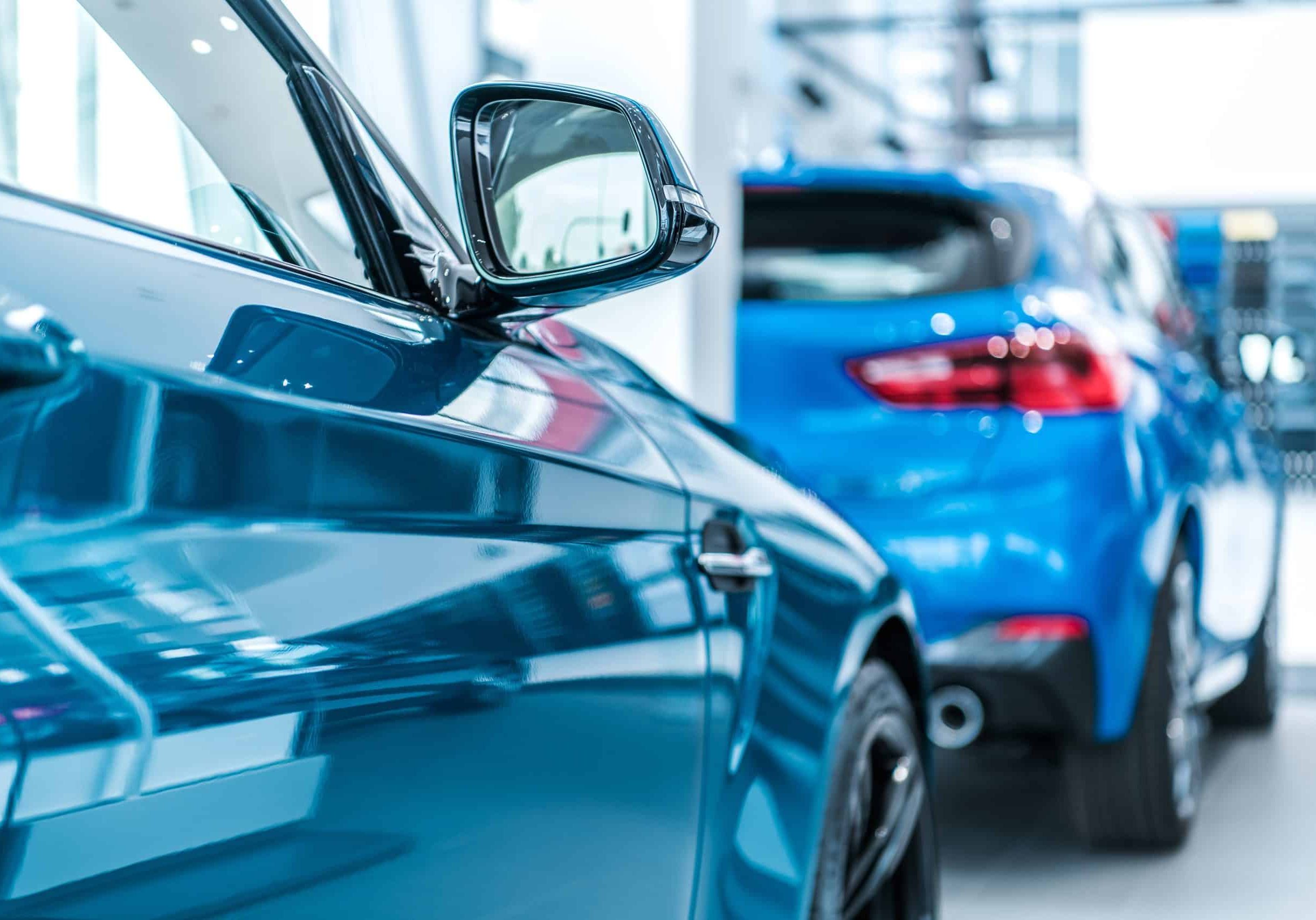 Car Dealer Showroom Display. Brand New Cars For Sale Awaiting Clients. Automotive Industry.